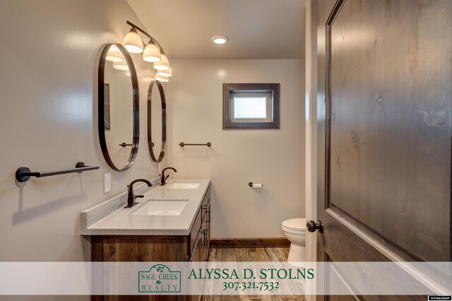 bathroom featuring a relaxing tiled tub and hardwood / wood-style floors