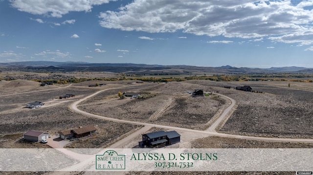 drone / aerial view with a rural view and a mountain view