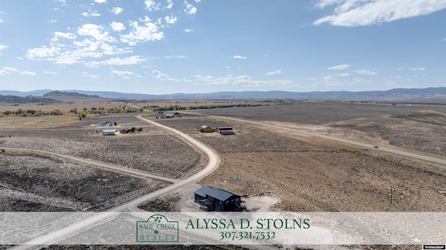 bird's eye view featuring a mountain view and a rural view