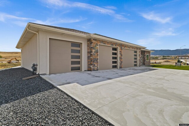 ranch-style house featuring a front yard and a garage