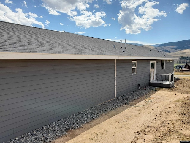 view of side of home featuring a mountain view