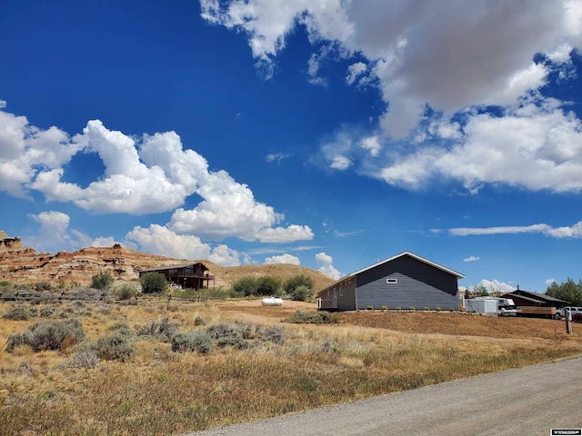 view of property exterior featuring a mountain view