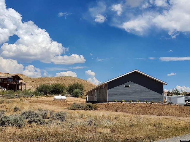 view of property exterior featuring a mountain view