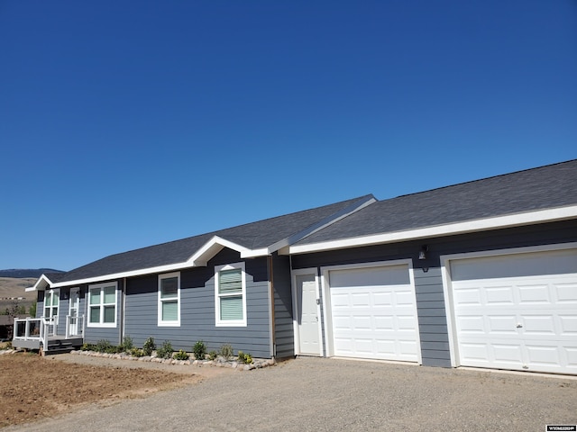 ranch-style home with a garage