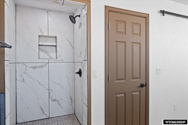 bathroom with a tile shower