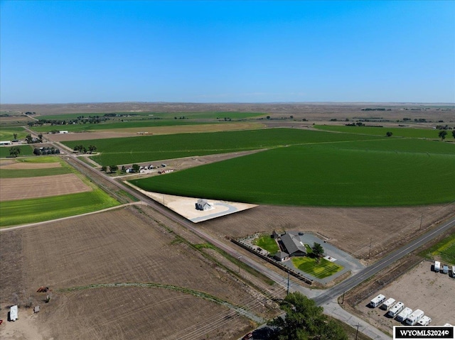 birds eye view of property with a rural view