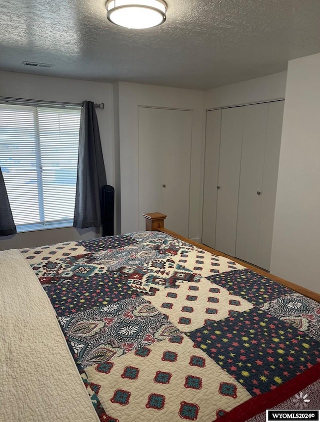 bedroom featuring a textured ceiling