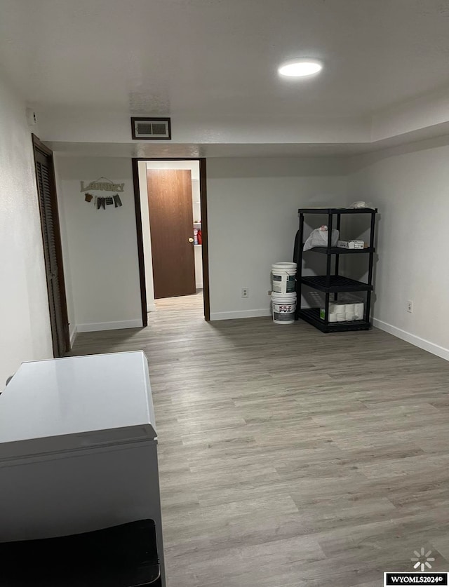 basement featuring hardwood / wood-style flooring