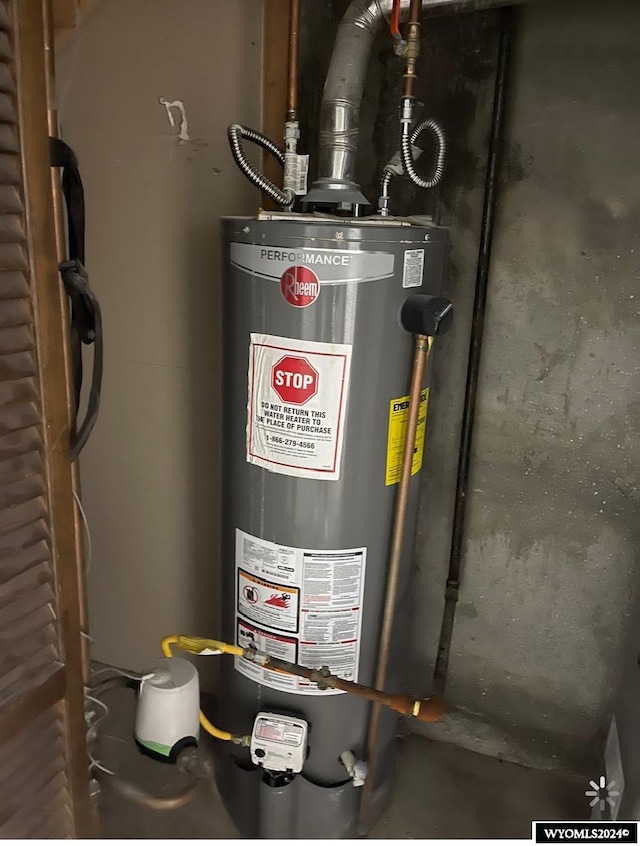 utility room featuring water heater