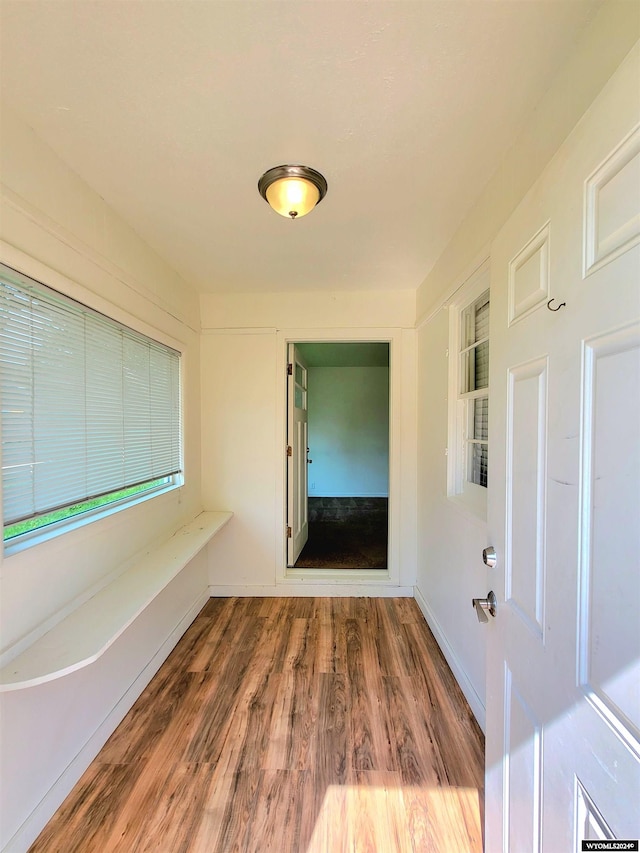 unfurnished room featuring wood-type flooring