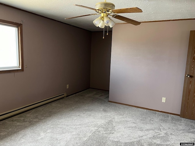 unfurnished room with a textured ceiling, carpet floors, ceiling fan, and a baseboard heating unit