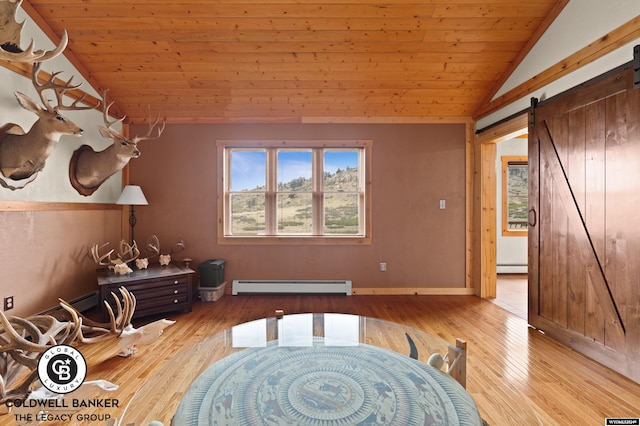 misc room with light hardwood / wood-style flooring, a baseboard radiator, wood ceiling, lofted ceiling, and a barn door