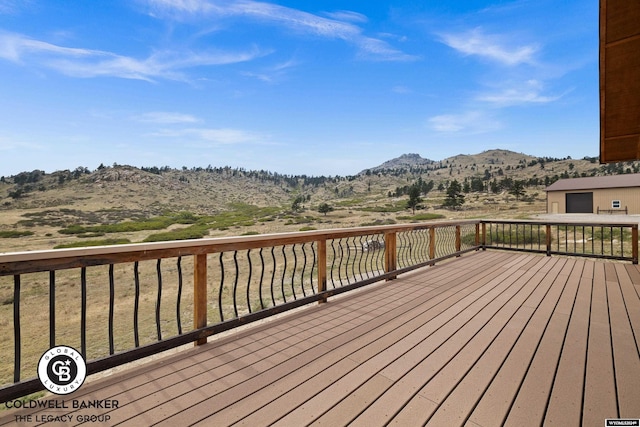 wooden terrace featuring a mountain view