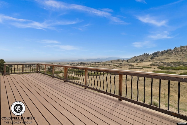 wooden terrace with a mountain view