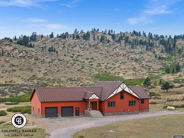 exterior space with a mountain view and a garage