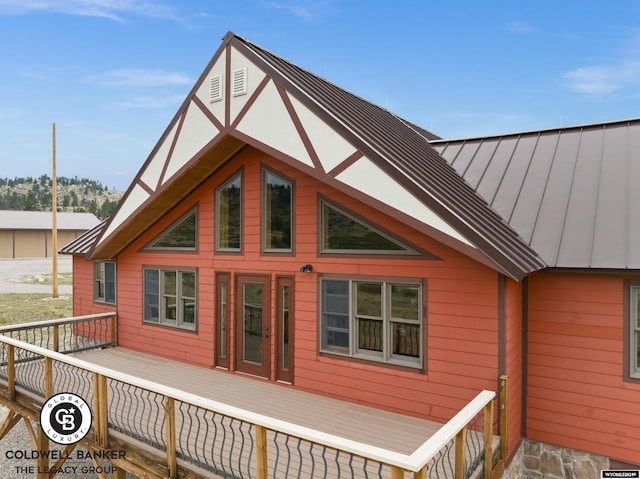 view of property exterior featuring a deck