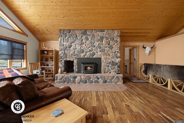 living room with wood ceiling, a stone fireplace, wood-type flooring, and lofted ceiling