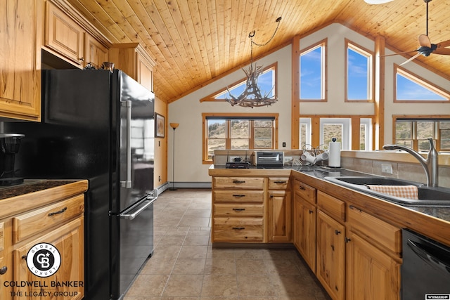 kitchen with decorative light fixtures, black appliances, high vaulted ceiling, and light tile patterned flooring