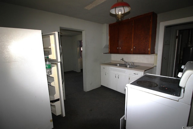 213 10th Ave, Lyman, NE 69352 - kitchen featuring a sink, white electric range oven, dark carpet, light countertops, and refrigerator