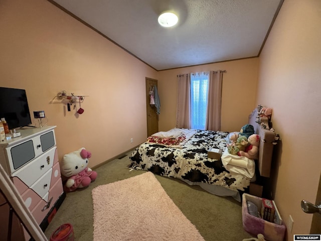 carpeted bedroom with crown molding, baseboards, and a textured ceiling