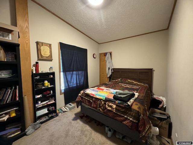 bedroom with lofted ceiling, ornamental molding, carpet floors, and a textured ceiling