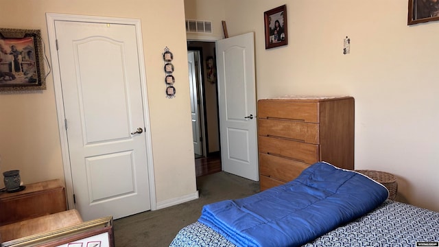 bedroom featuring dark carpet