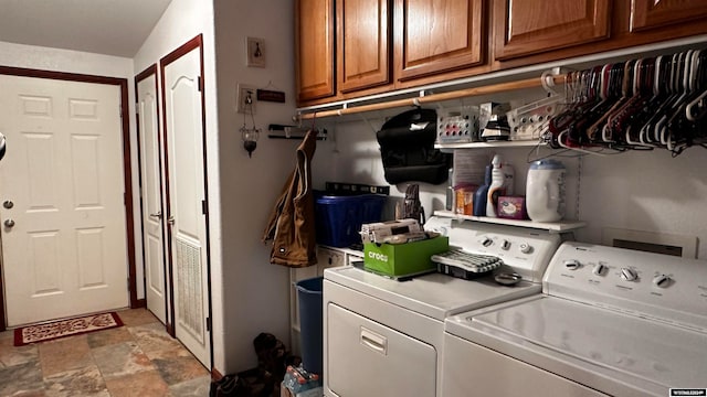 laundry area featuring cabinets and independent washer and dryer