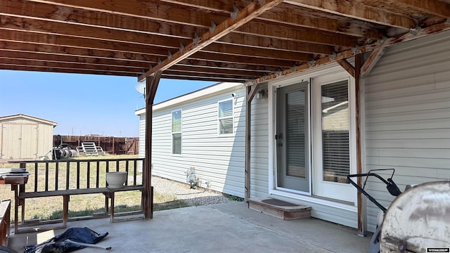 view of patio / terrace featuring a shed