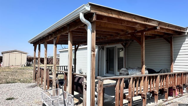 view of patio / terrace featuring a storage unit