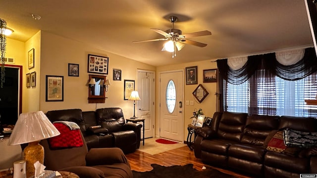 living room featuring a wealth of natural light, ceiling fan, hardwood / wood-style floors, and vaulted ceiling