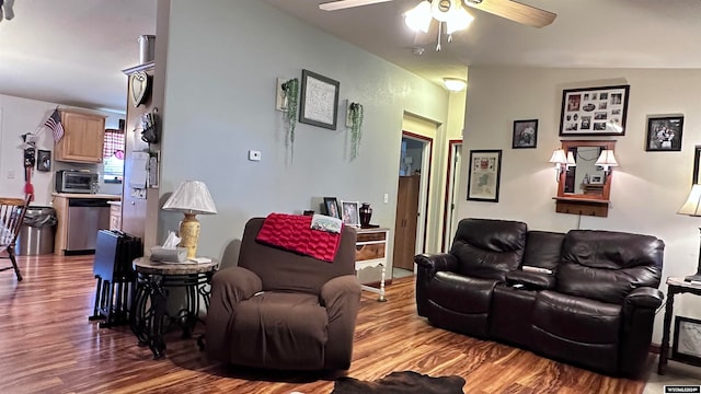 living room featuring lofted ceiling, hardwood / wood-style floors, and ceiling fan