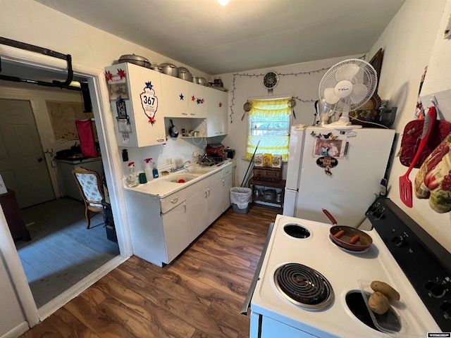 kitchen featuring white appliances, dark hardwood / wood-style flooring, and white cabinetry