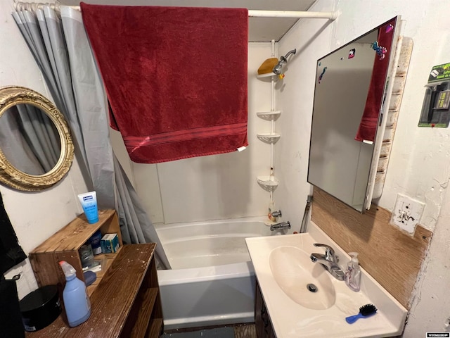 bathroom with bathing tub / shower combination and vanity