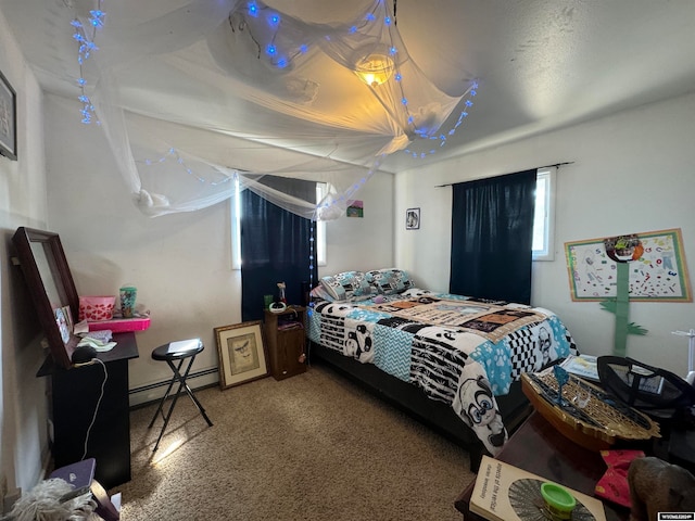 bedroom featuring a baseboard heating unit and carpet floors