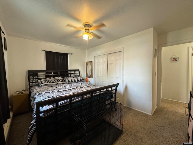 carpeted bedroom with a textured ceiling, ceiling fan, and a closet