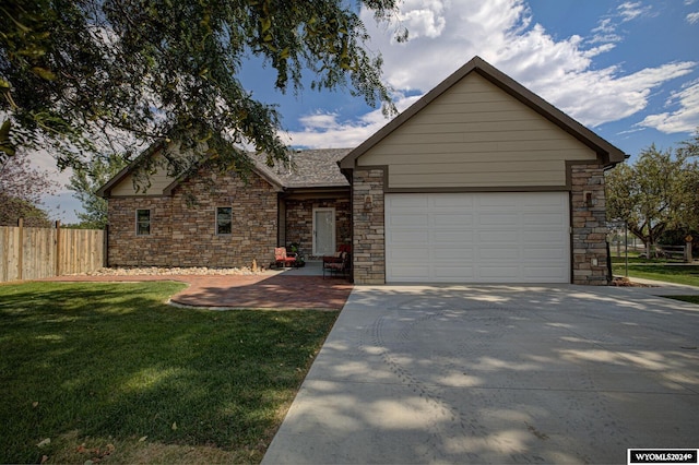 ranch-style house with a garage and a front yard