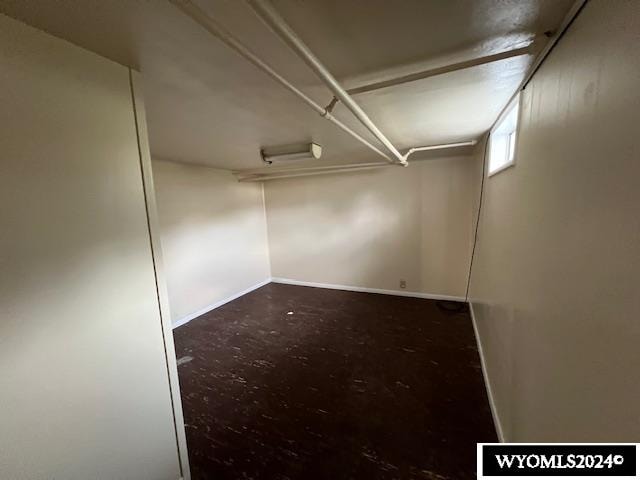 empty room with concrete flooring