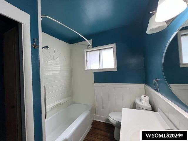 full bathroom featuring vanity, toilet, hardwood / wood-style floors, and shower / bathing tub combination
