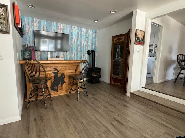 bar featuring dark wood-type flooring