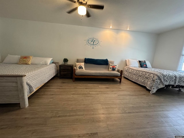 bedroom featuring hardwood / wood-style floors and ceiling fan