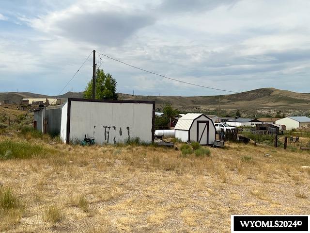 view of outbuilding featuring a mountain view