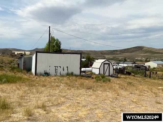 156 Elm St, Kemmerer, WY 83101 - view of yard featuring a mountain view