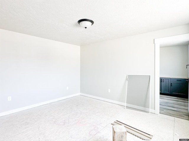 empty room with a textured ceiling