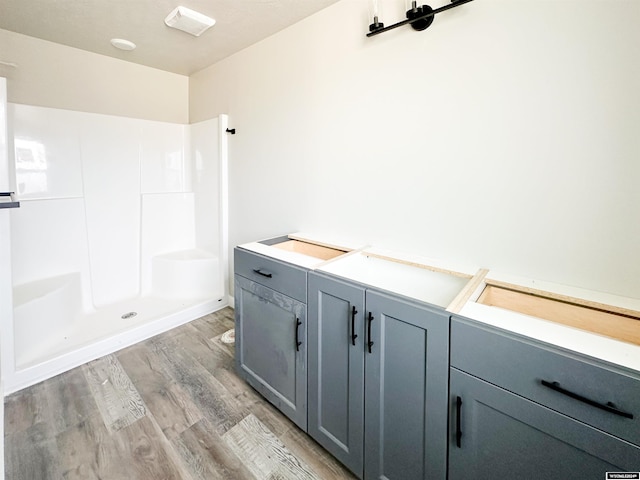 bathroom with hardwood / wood-style floors