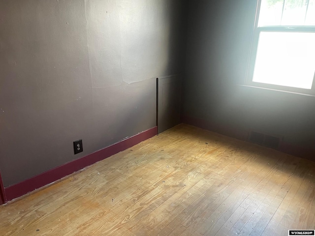 spare room featuring light hardwood / wood-style floors