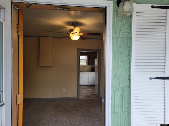 exterior space featuring ceiling fan