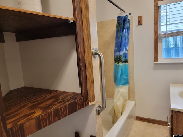 bathroom with vanity and shower / tub combo with curtain