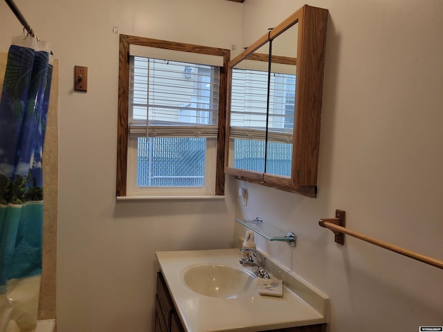 bathroom with vanity and a shower with curtain