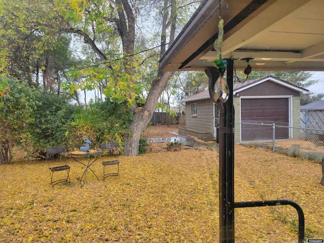 view of yard with an outbuilding and a garage