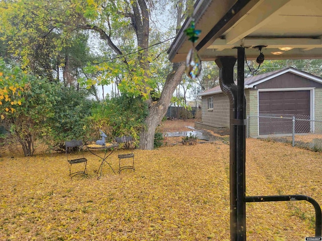 view of yard with an outdoor structure and a garage